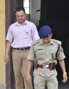 The accused police commando personnel in connection of killing Th. Sanjit on July 23 2009 being escorted by a police officer at CJM Imphal Cheirap court on Monday. Photo: K. Bipin Sharma, Imphal
