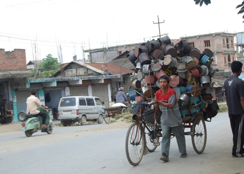 A rickshaw carrying fire pots ("meiphus") to the market. Since the beginning of December fire pots has been in great demand as Manipur has been reeling under intense cold. | 2010-12-18 by : IFP Photo