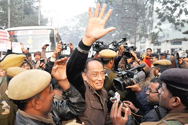 Arrested UNLF chairman RK Meghen waving to the people who had turned up to greet him at the NIA court premises in Guwahati.
