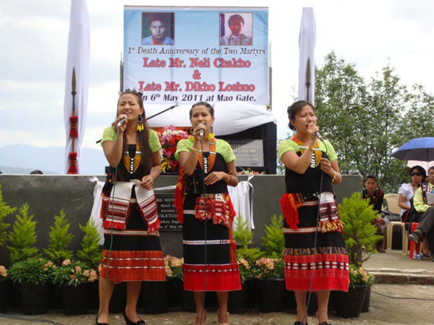 Girls in traditional attire singing during the 1st first anniverssary of the death of two students in Mao on May 6, 2010. 