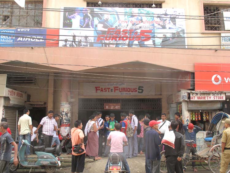 Cinema goers inquiring about the ticket price from the black marketeers during the first day showing of the Hollywood flick, Fast & Furious after the decade long lull at the Usha cinema hall in the heart of Imphal.