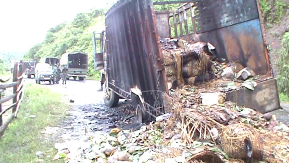 A loaded truck burnt down by the agitated volunteers of Sadar Hills Districthood Demand Committee at Kangpokpi on the evening of September 6. 