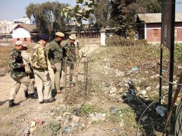 Imphal East police inspecting the explosion site in front of the Raja Dumbra High School on Friday