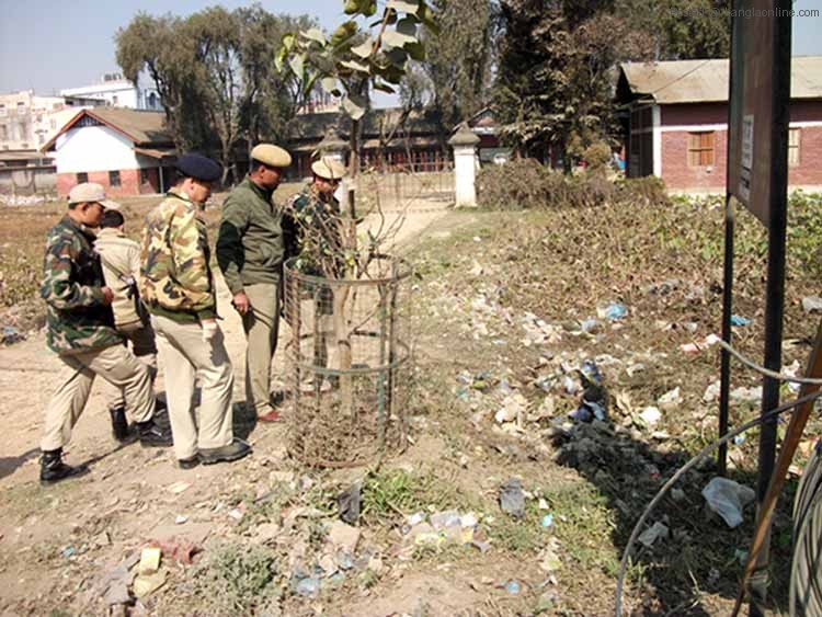 Imphal East police inspecting the explosion site in front of the Raja Dumbra High School on Friday
