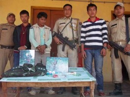 Manipur Drug Haul - Thoubal police parading the arrested NSCN (IM) captain with the seized drugs on Sunday.