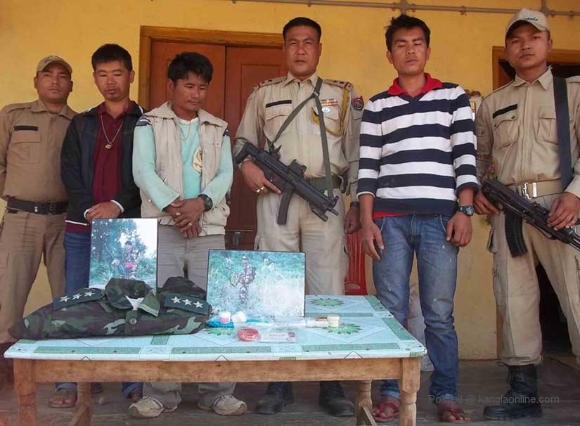 Manipur Drug Haul - Thoubal police parading the arrested NSCN (IM) captain with the seized drugs on Sunday. 