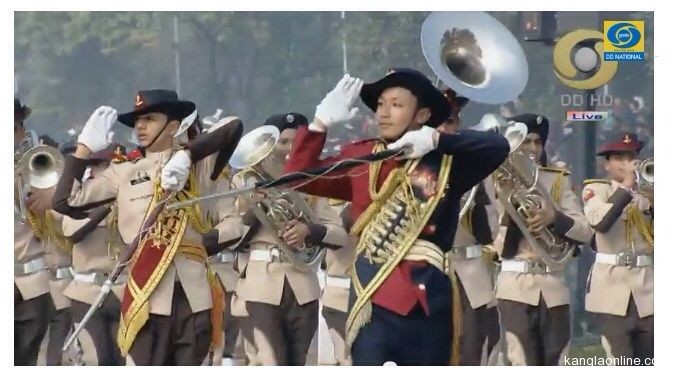 Manipur Native, Varun Nepram (in red dress and holding staff), leading the Boys’ NCC Band Contingent at the 65th Republic Day Celebrations, 2014 (photo courtesy: Doordarshan)