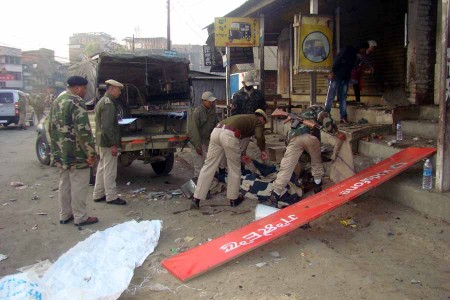 Police personnel inspecting the blast site at Khuyathong.