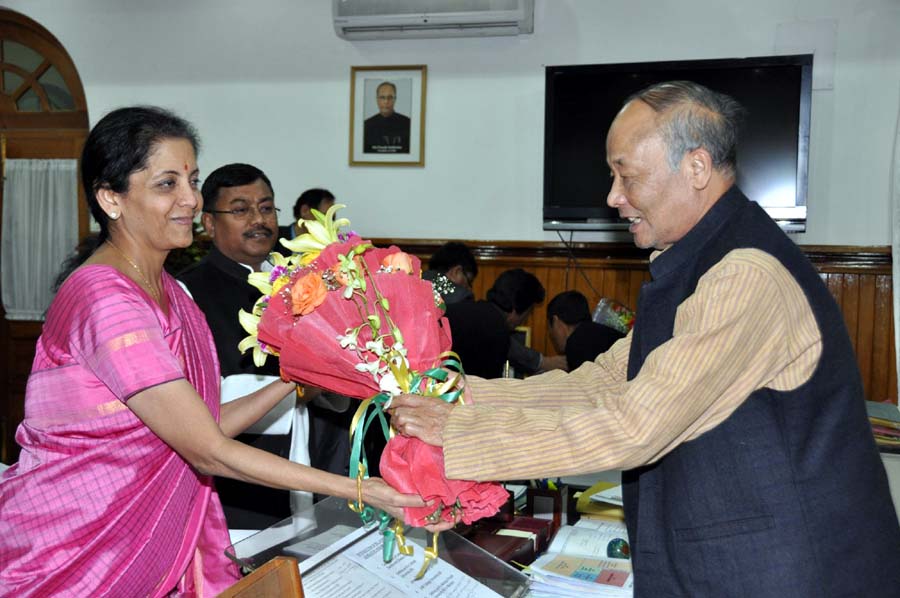Chief Minister Okram Ibobi Singh handing over a bouquet to Union Ministr of Commerce and Industries Nirmala Sitharaman on Monday.