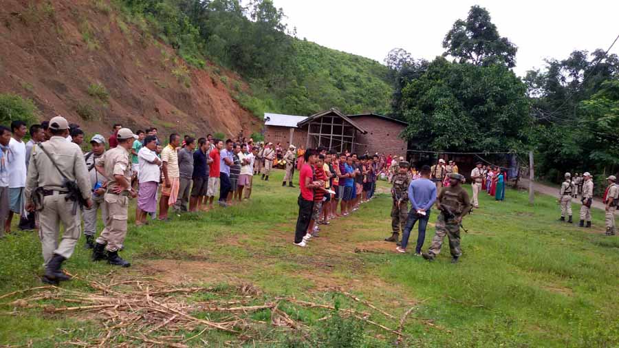 Locals of Saiton Bishnupur lined up for identification during the search operation on the eve of I-Day.