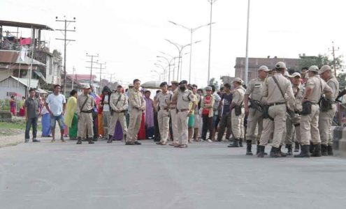 Police personnel trying to pacify the agitating locals of Singjamei and to call off the road block on Tuesday. IFP Photo