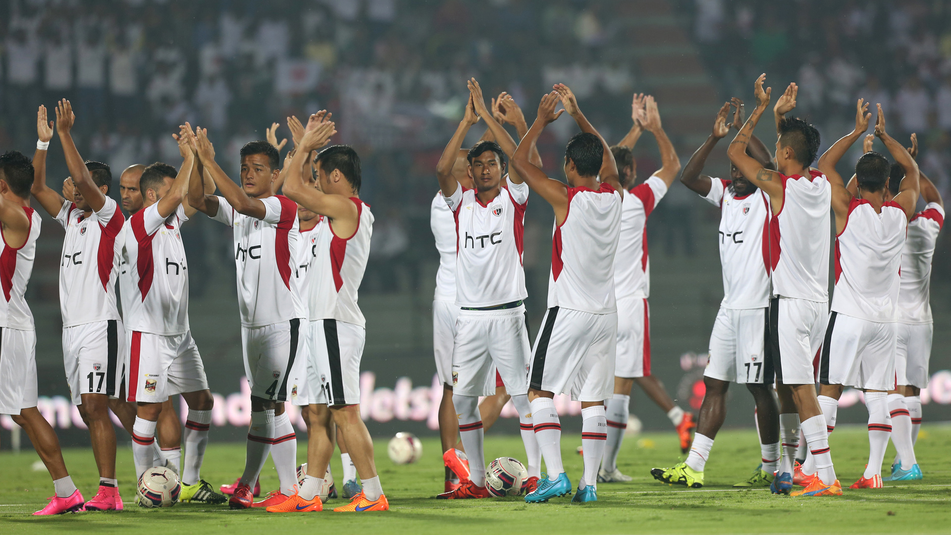 NorthEast United FC Players waves towards the crowd during the warm up session before the match 38 of the Indian Super League (ISL) season 2 between NorthEast United FC and Kerala Blasters FC held at the Indira Gandhi Stadium, Guwahati, India on the 15th November 2015. Photo by Deepak Malik / ISL/ SPORTZPICS