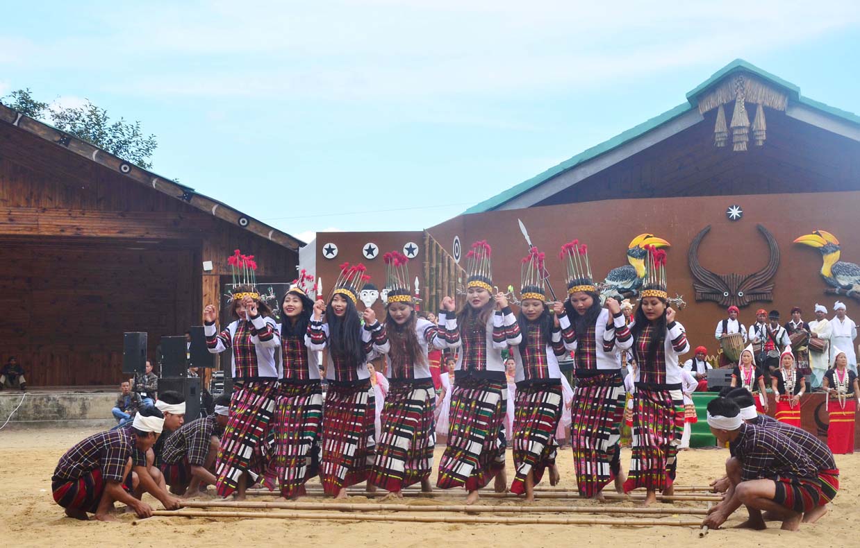 Artist from Mizoram perform a bamboo dance on the second day of the state annual Hornbill Festival at Naga Heritage village Kisama, some 15 kms away from Kohima, Nagaland on Friday, December 02, 2016. Photo by Caisii Mao