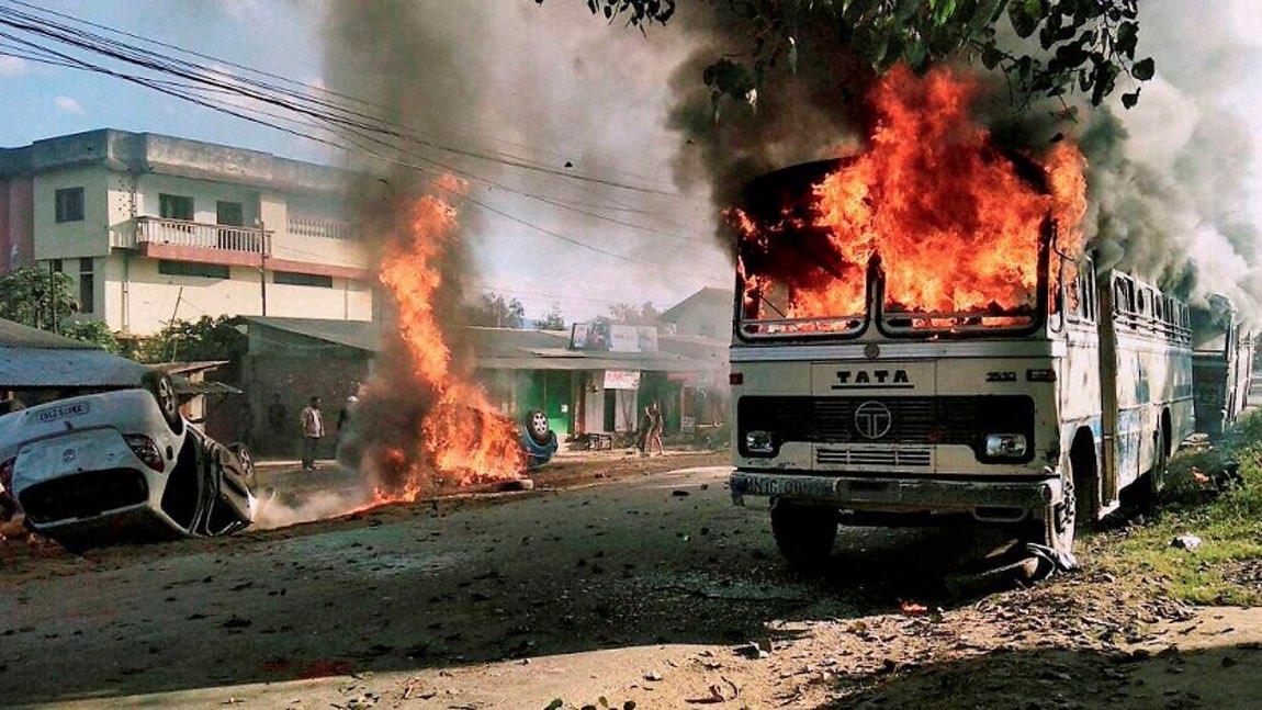  Angry mobs set vehicles on fire in Imphal East district on Sunday in protest against the United Naga Council’s indefinite economic blockade. (Photo: PTI) 