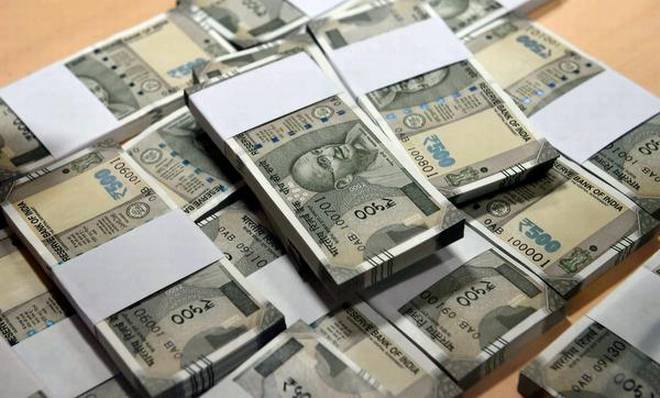 The Budget proposes to levy penalty on a person who receives ₹3 lakh and above.   | Photo Credit: PTI 